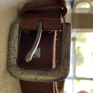 Woman’s brown studded belt